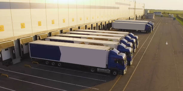 Distribution warehouse with trucks awaiting loading.