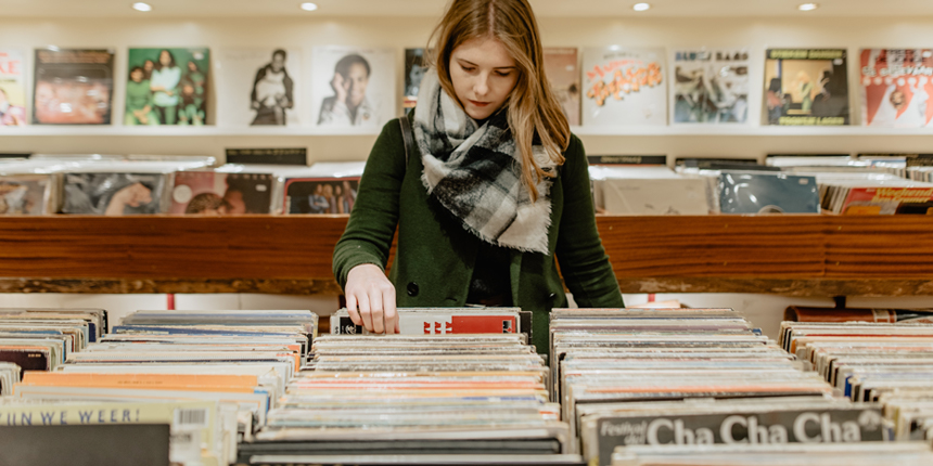 Woman browsing records at a store.