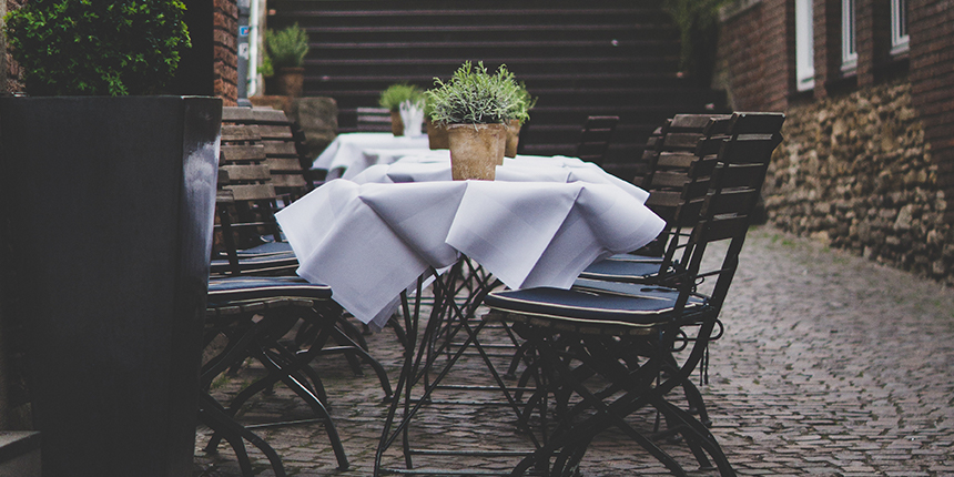 Restaurant tables with white tablecloths
