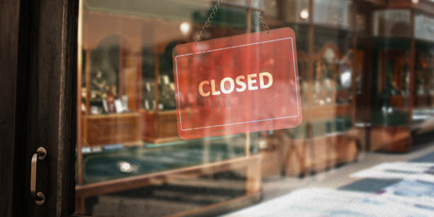 Red closed sign on shop door