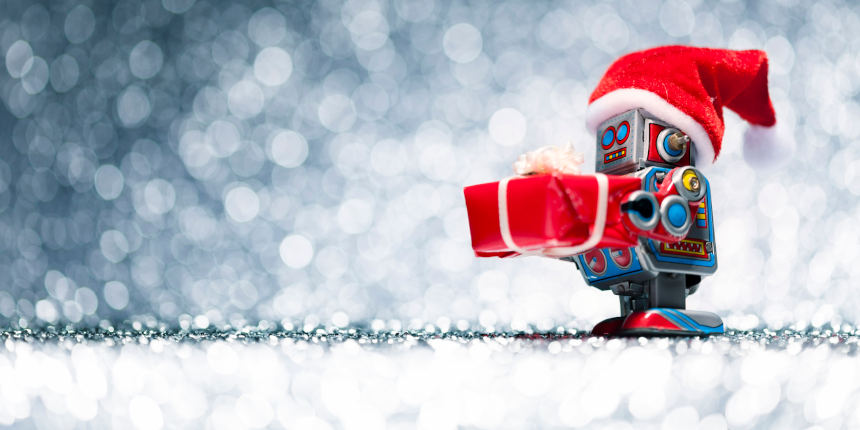 Retro tin toy Santa robot holding Christmas present