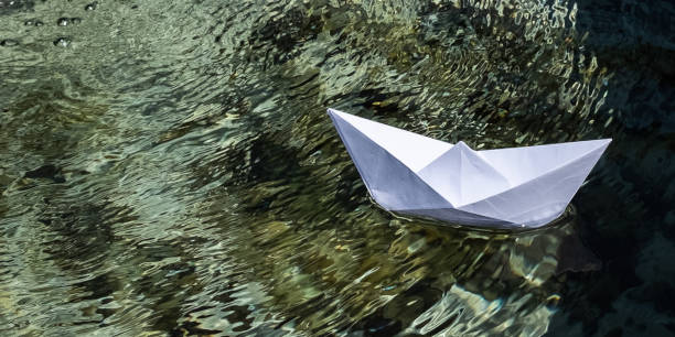 Paper boat on the water