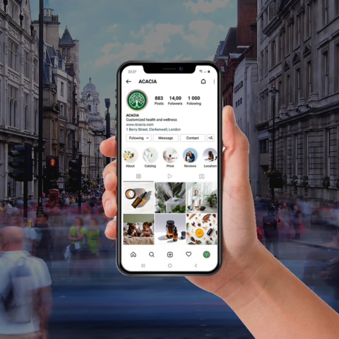 A woman holding a smartphone that is projecting an augmented padlock icon.