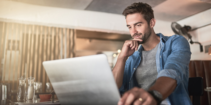 Man looking at laptop screen.