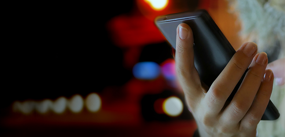 Woman's hand holding smartphone