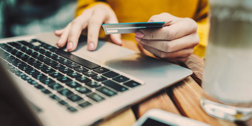 Woman shopping using her laptop